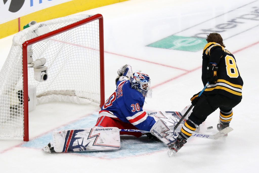 Henrik Lundqvist stops a shot by David Pastrnak - Photo by Jack Lima