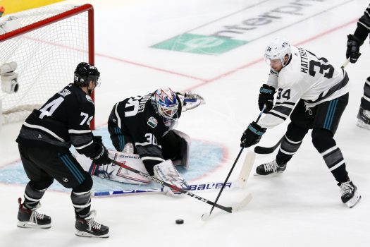 Metropolitan goalie Henrik Lundqvist stops a scoring attempt by Auston Matthews (34) as John Carlson (74) defends