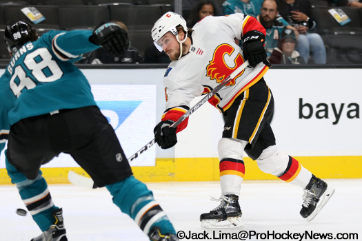 Calgary defenceman Rasmus Andersson (4) takes a shot on goal