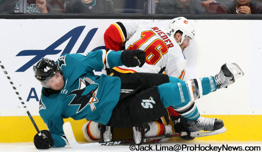 Sharks Marc-Edouard Vlasic (44) and Calgary forward Tobias Rieder (16) collide along the boards