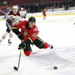 Adam Ruzicka skates with puck