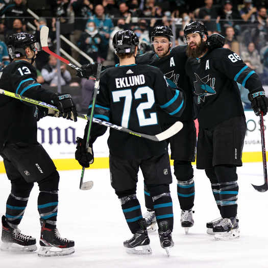 Brent Burns (88) celebrates his goal with teammates