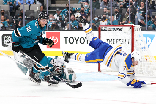 Rasmus Asplund dives for the puck; Mario Ferrero and Goalie James Reimer sprawls on the ice. Rasmus Asplund dives for the puck; Mario Ferrero and Goalie James Reimer sprawls on the ice.