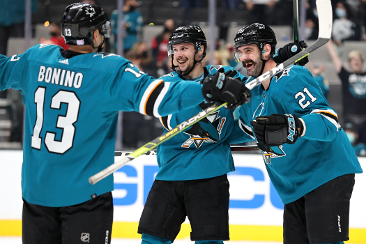 Jacob Middleton (21) celebrates his first NHL goal with Erik Karlsson (center) and Nick Bonino (13)