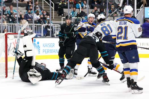 James Neil (81) scores the go ahead goal past Sharks goalie Adin Hill