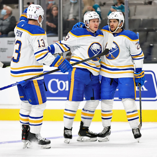 Jeff Skinner (Center) celebrates his first period goal with Mark Pysyk (13) and Vinnie Hinostroza (29)