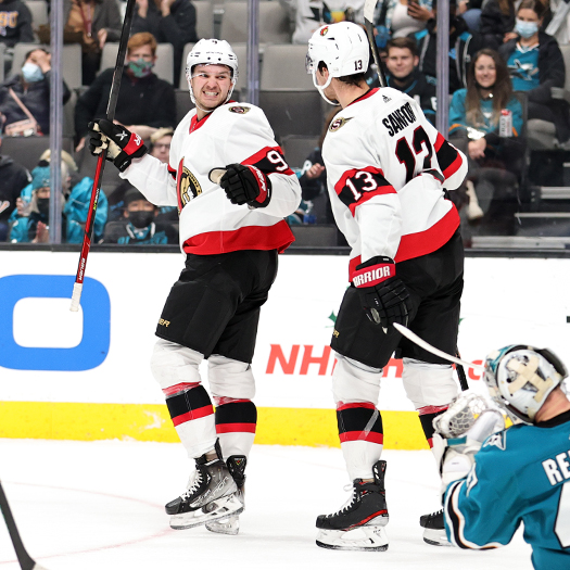 Josh Norris (9) celebrates his first period goal with Zack Sanford (13)