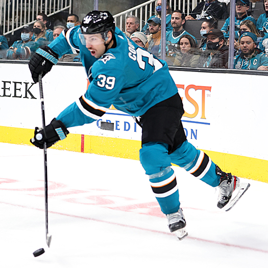 Logan Couture clears the puck