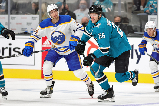 Sharks Jasper Weatherby (26) breaks up ice as Dylan Cozens (24) chases