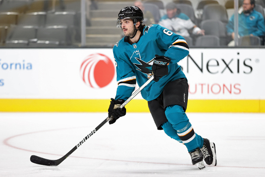 Sharks defenseman Ryan Merkley looks to make a pass