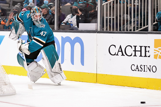 Sharks goalie James Reimer clears the puck