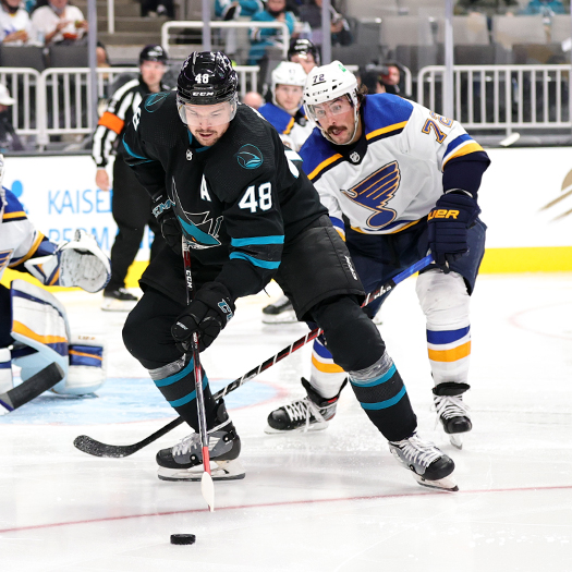 Tomas Hertl (48) controls the puck in front of Blues defenseman Justin Faulk (72)