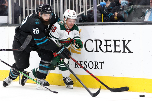 Brent Burns (88) fights Mason Shaw (58) for the puck - Photo by Jack Lima