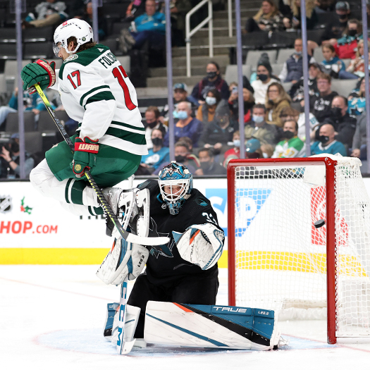 Marcus Foligno (17) jumps to avoid a shot in front of Sharks goalie Adin Hill - Photo by Jack Lima