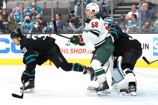 Mario Ferraro (38) battles Mason Shaw (58) for position in front of Sharks goalie Adin Hill - Photo by Jack Lima