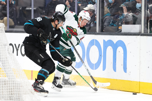 Mario Ferrero (38) battles Kirill Kaprizov (97) for the puck - Photo by Jack Lima