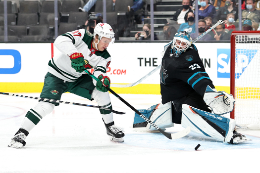 Sharks goalie Adin Hill makes a stop by Kirill Kaprizov during third period action. Photo by Jack Lima