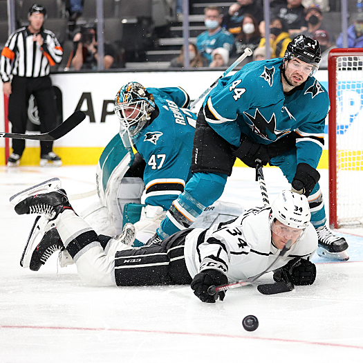 Arthur Kaliyev (34) dives for a rebound as Marc-Edouard Vlassic (44) defends