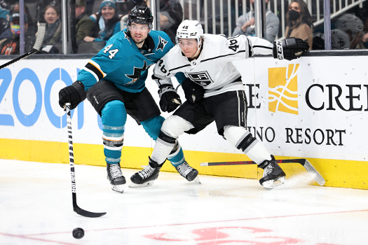 Marc-Edouard Vlassic (44) and Blake Lizotte (46) look to control the puck
