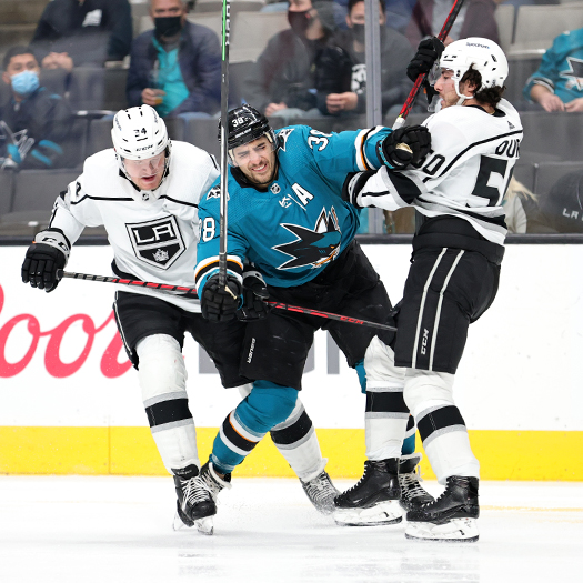 Mario Ferraro collides with Phillip Danault (Left) and Sean Durzi (50)