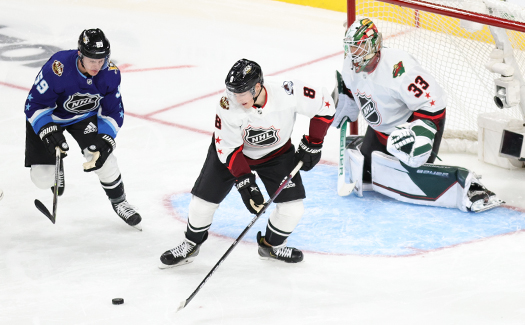 Cale Maker (8) moves a rebound away from Jake Guentzel (59) in front of goaltender Cam Talbot