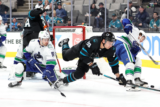 Timo Meier (28) trips over Juho Lammikko (91)