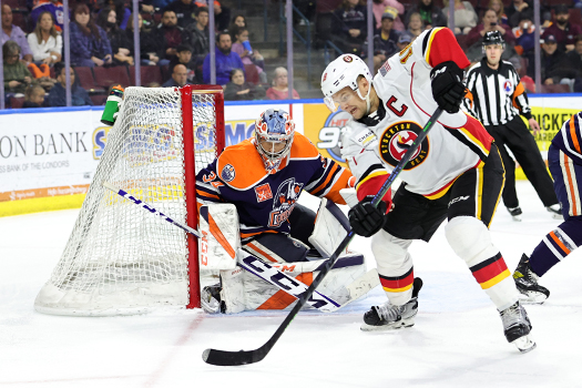Byron Froese (18) attempst a shot during second period action