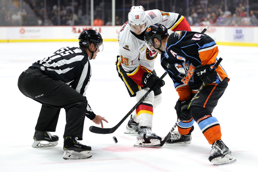 Byron Frose (18) and Danny O'Regan fight for the puck after a face-off battle - Photo by Jack Lima