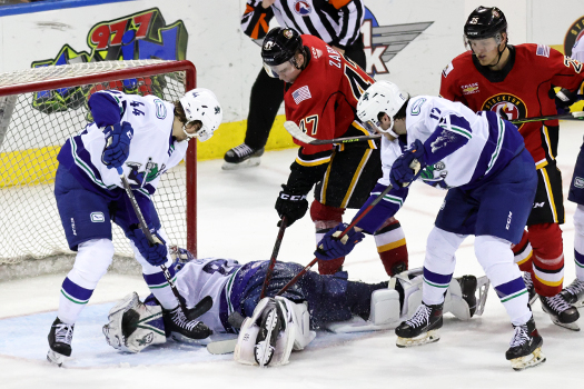 Canucks' goalie Michael lays on top of the puck to make a save during third period action