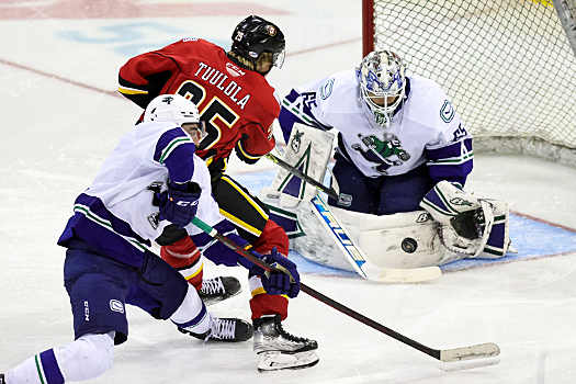 Canucks' goalie Michael stops a shot from Eetu Tuulola (25)