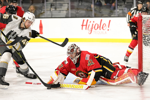 Heat goalie Dustin Wolf stop a shot by Jonas Rondbjerg (46)