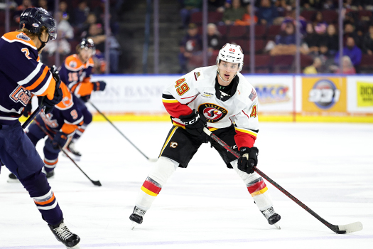 Jakob Pelleiter (49) looks to pass as Philip Broberg (2) defends