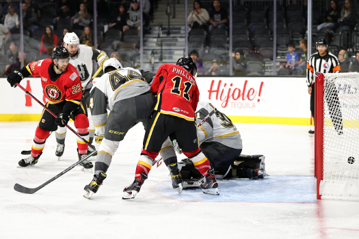 Justin Kirkland (23) scores on a back-handed shot during third period action