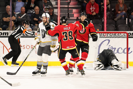 Luke Philp (39) celebrates with Byron Froese who scored the game winning overtime goal