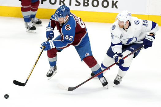 Artturi Lehkonen (62) controls the puck as Corey Perry (10) defends