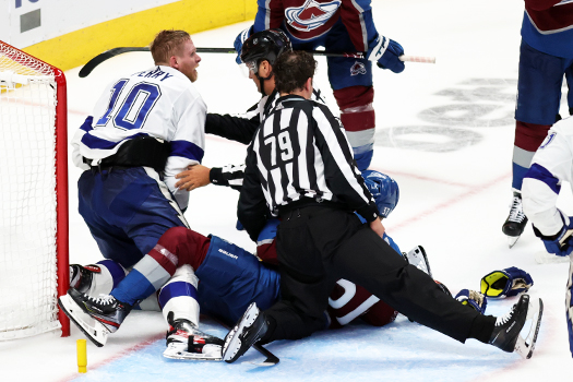 Corey Perry (10) battles J.T. Compher