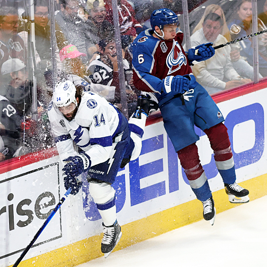 Pat Maroon (14) and Erik Johnson (6) collide behind the net