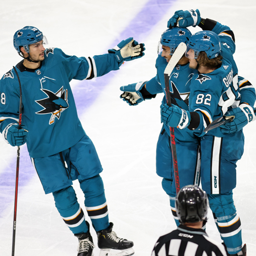 Artem Guryev (82) celebrates his first period goal with Dillon Hamaliuk (Left) and Montana Onyebuchi (Center)