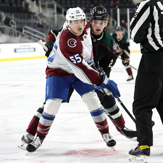 Austin Roest (55) and Conor Geekie (28) look for the puck after facing off