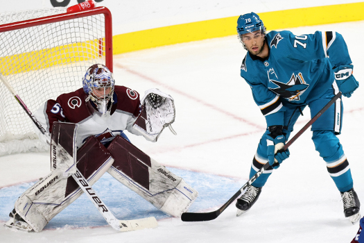 Brandon Coe (70) looks for a pass in front of Avalanche goalie Trent Miner