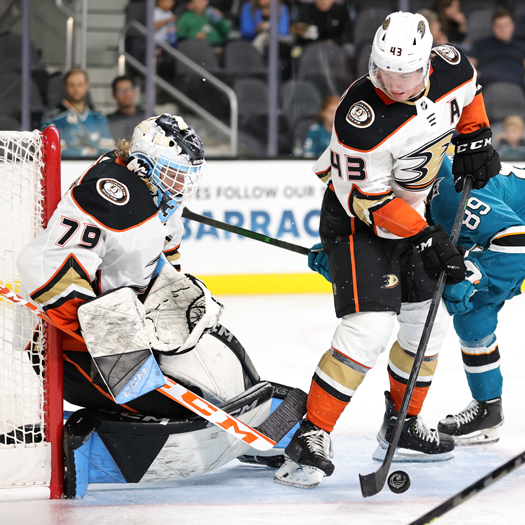 Ducks defenseman Drew Helleson (43) looks to clear a rebound in front of goalie Gage Alexander