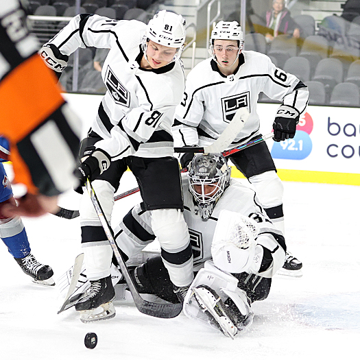Kings goalie Jacob Ingham makes a save as defenseman Angus Booth (81) clears the rebound
