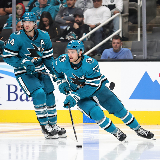 Noah Gregor (73) moves the puck up ice in front of Marc-Edouard Vlassic (44)