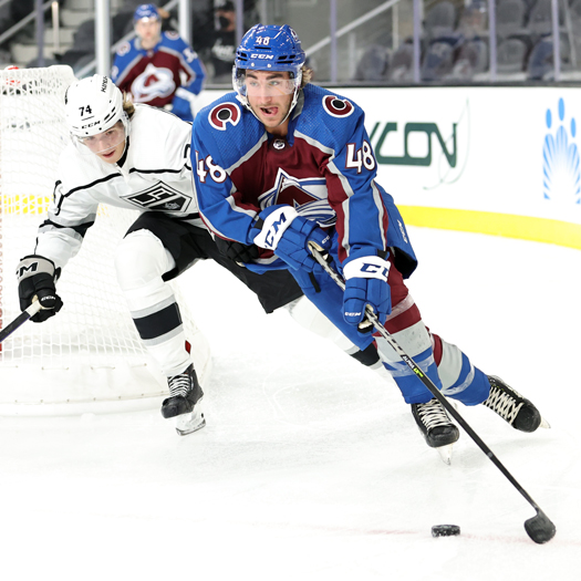 Olivier Boutin (48) skates the puck around the net as Aatu Jamsen (74) defends
