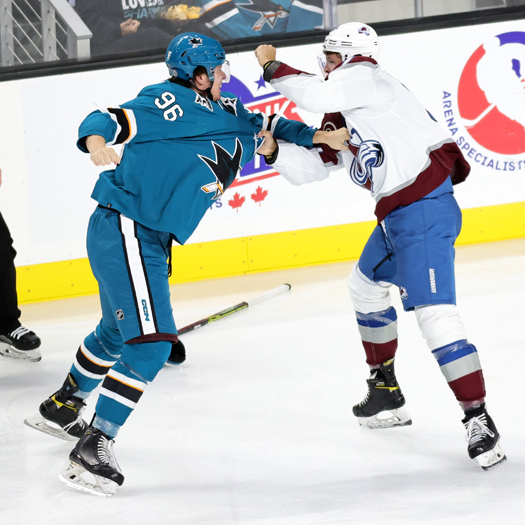 Samuel Mayer (96) and Cameron Wright (57) fight during second period action