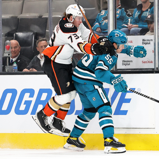 Sean Tschigerl (73) tries to move around Derrick Pouliot (55)