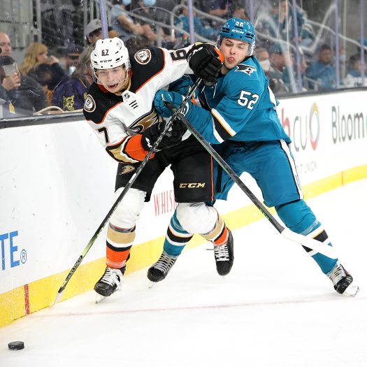 Tristan Luneau (67) and Tristen Robins (52) fight for the puck