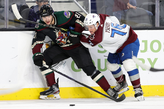 Zach Tsekos (76) checks Milos Kelemen (21) off the puck
