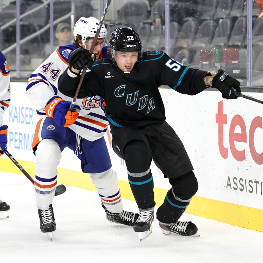 Darian Kielb (44) and Tristen Robins (52) battle for position behind the net