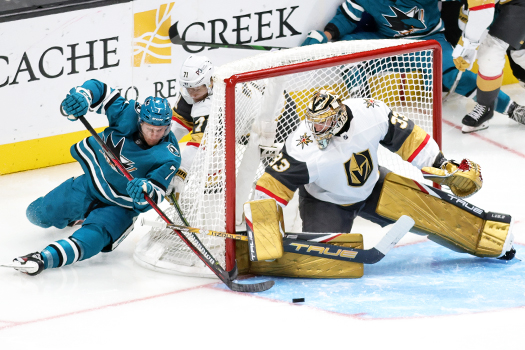 Nico Sturm (7) attempts a wraparound shot on goalie Adin Hill